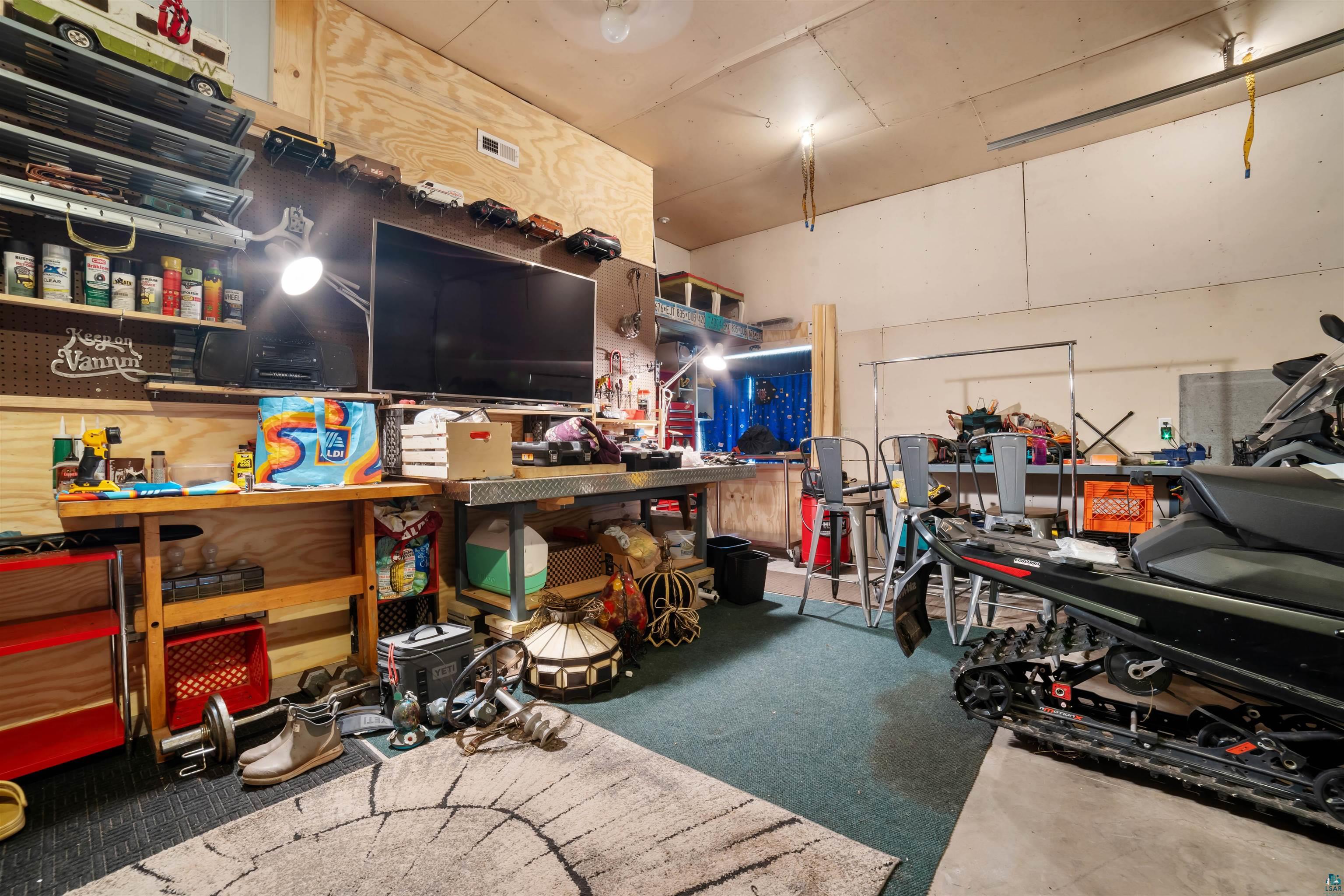 1159 East County Rd B Foxboro, WI 54836 - Photo 25 of 29 Garage with a workshop area