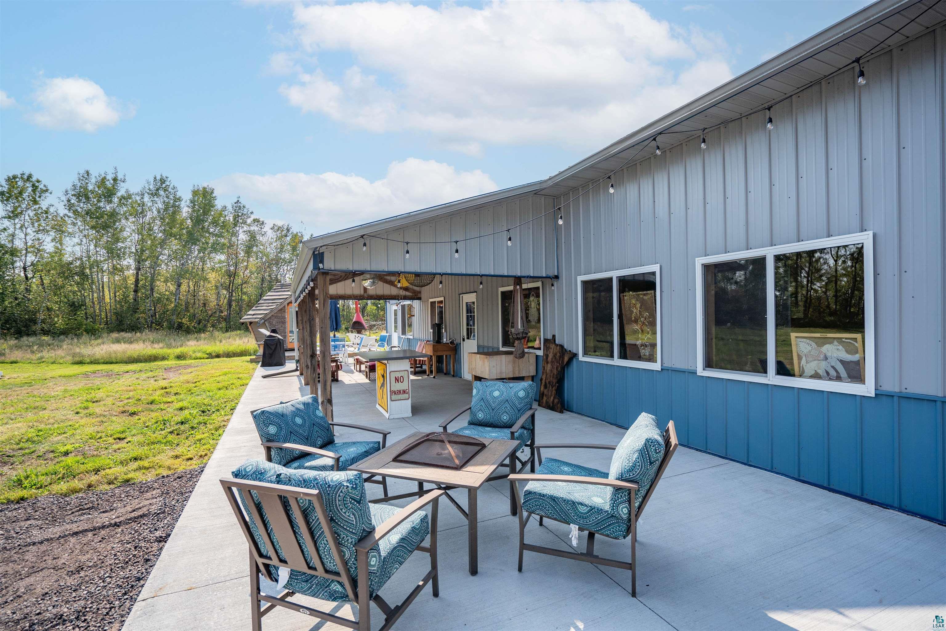 1159 East County Rd B Foxboro, WI 54836 - Photo 8 of 29 View of patio featuring an outdoor living space with a fire pit