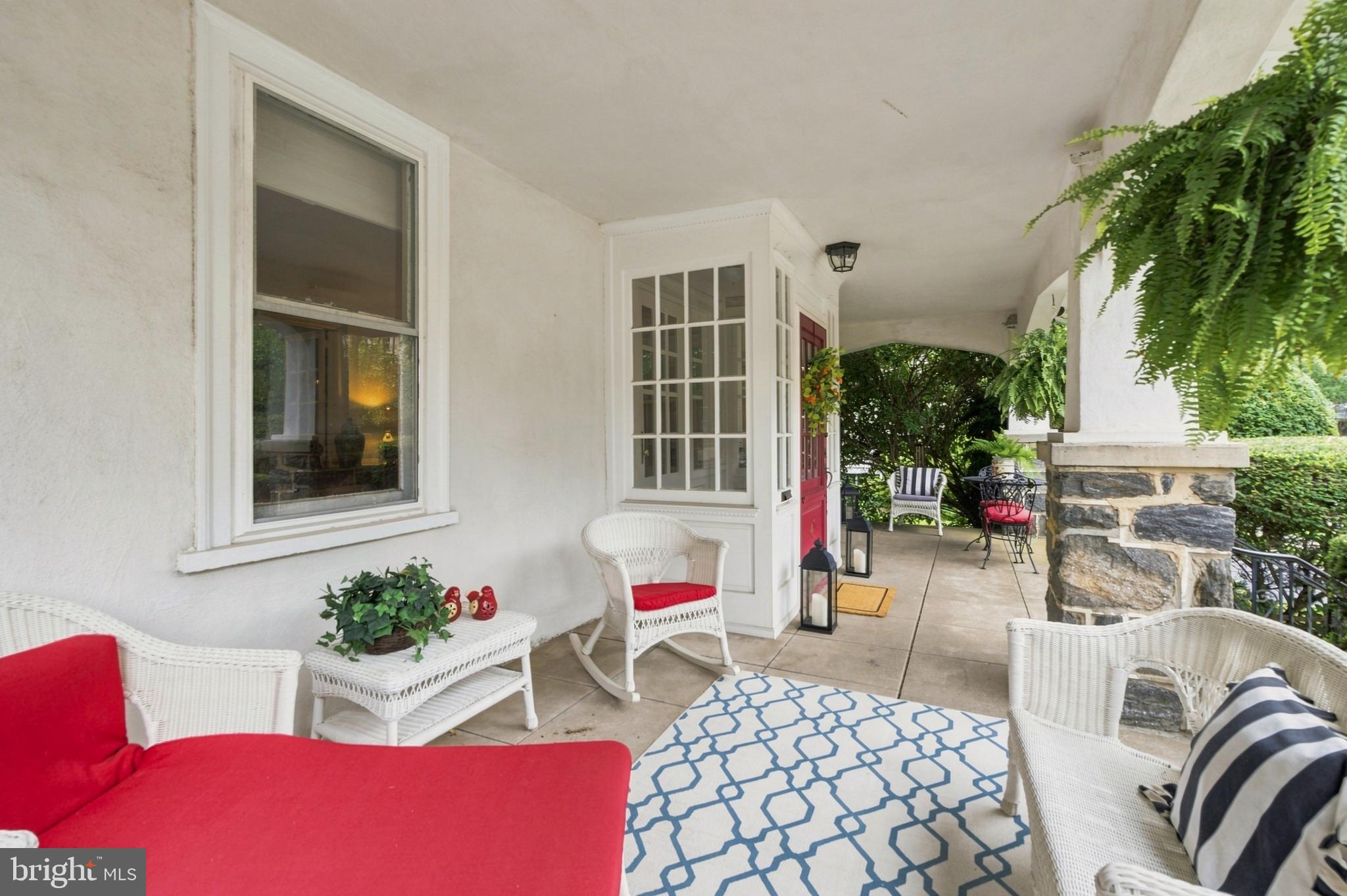 Charming porch with inviting decor.