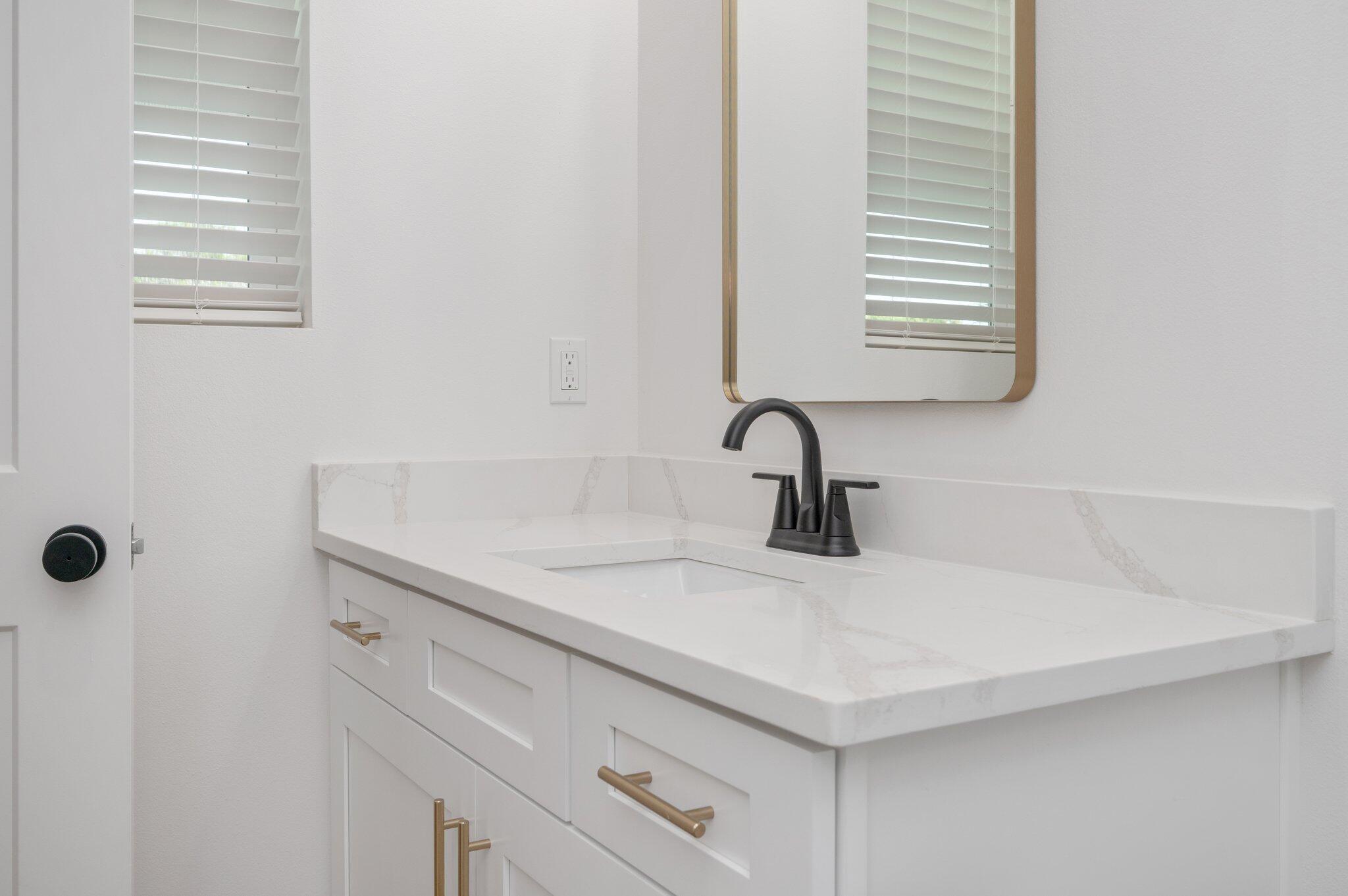 4550 Luke Avenue Destin, FL 32541 - Photo 26 of 69 a close view of a sink a vanity and a tap