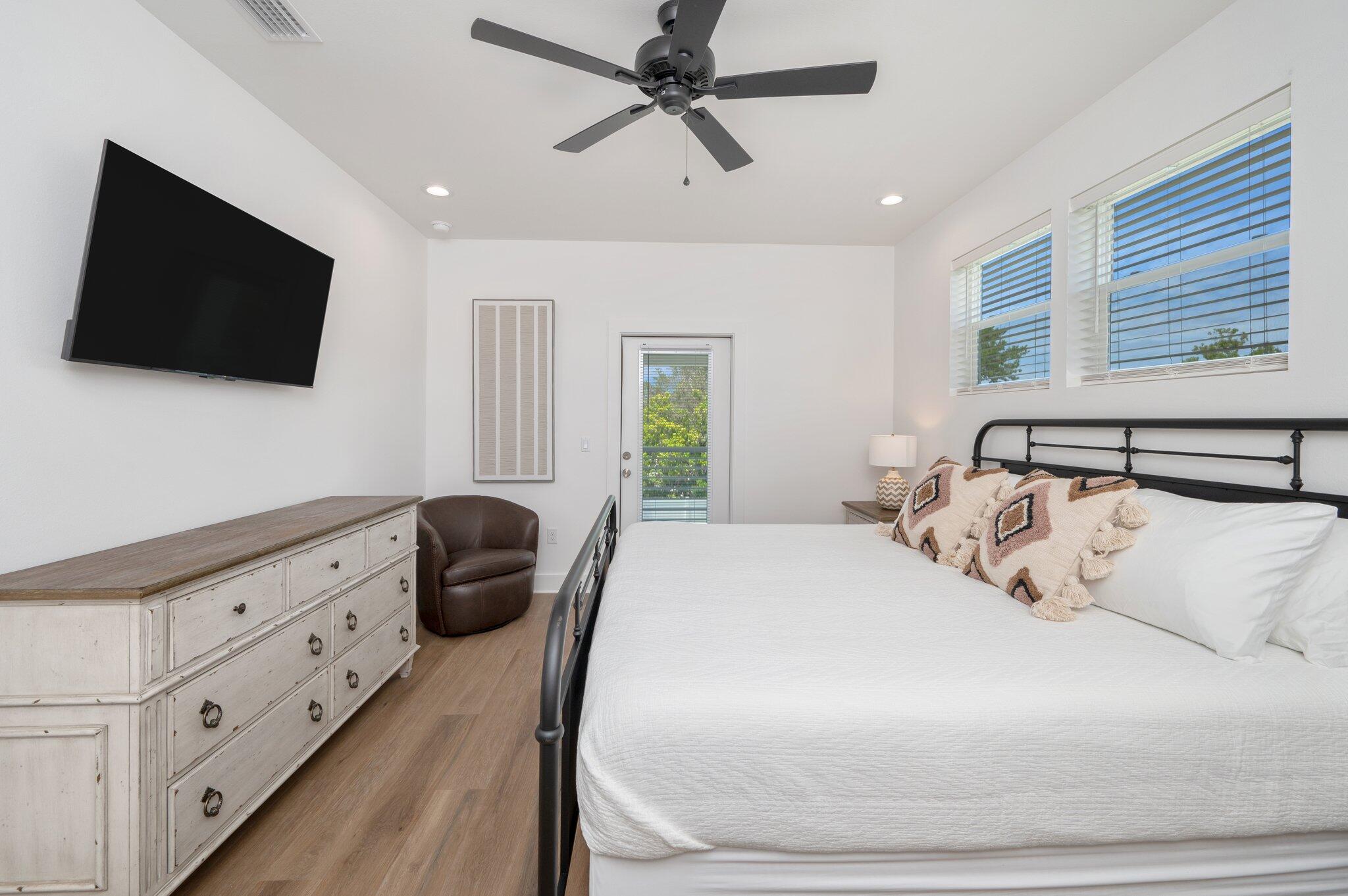 4550 Luke Avenue Destin, FL 32541 - Photo 29 of 69 a bedroom with a bed a flat screen tv and a window