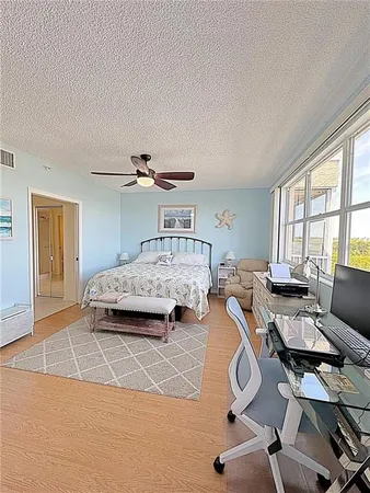 a bedroom with furniture and a window