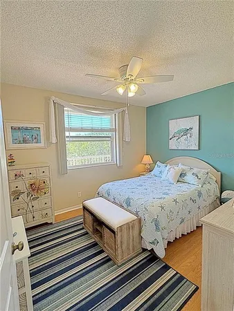 a bedroom with bed and window