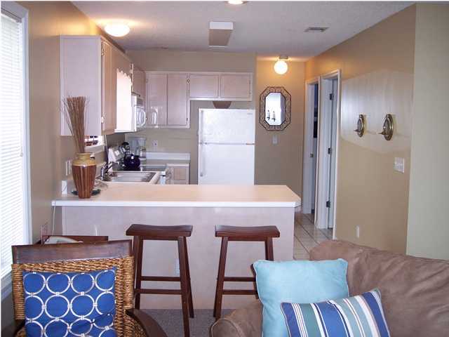 11 Beachside Drive, Unit 1211 Santa Rosa Beach, FL 32459 - Photo 6 of 15 a dining room with furniture and window