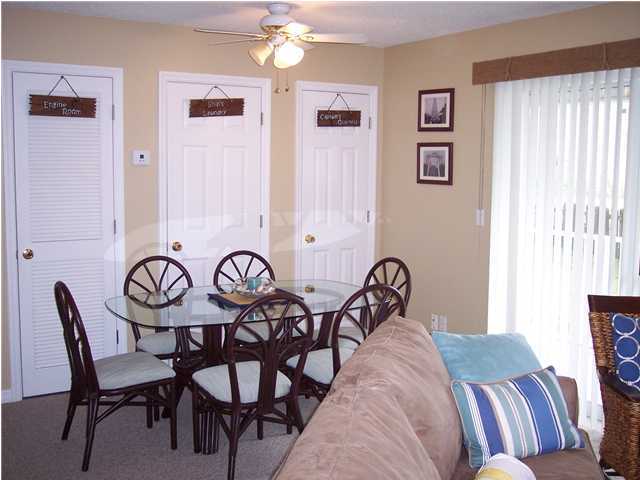 11 Beachside Drive, Unit 1211 Santa Rosa Beach, FL 32459 - Photo 7 of 15 a view of a dining room with furniture and chandelier