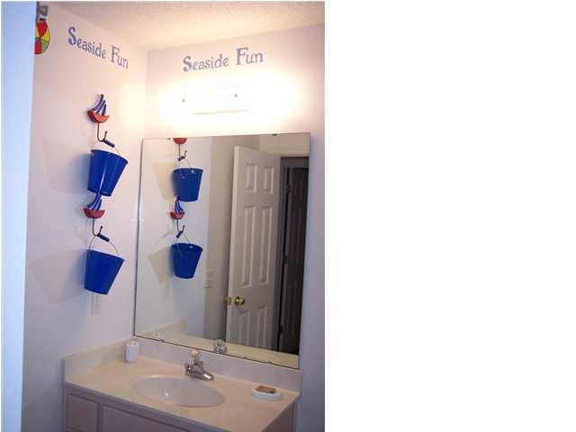 11 Beachside Drive, Unit 1211 Santa Rosa Beach, FL 32459 - Photo 9 of 15 a bathroom with a sink and mirror