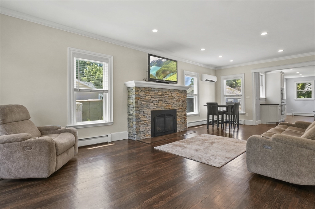 5 Waban Street Natick, MA 01760 - Photo 11 of 32 a living room with furniture and a fireplace