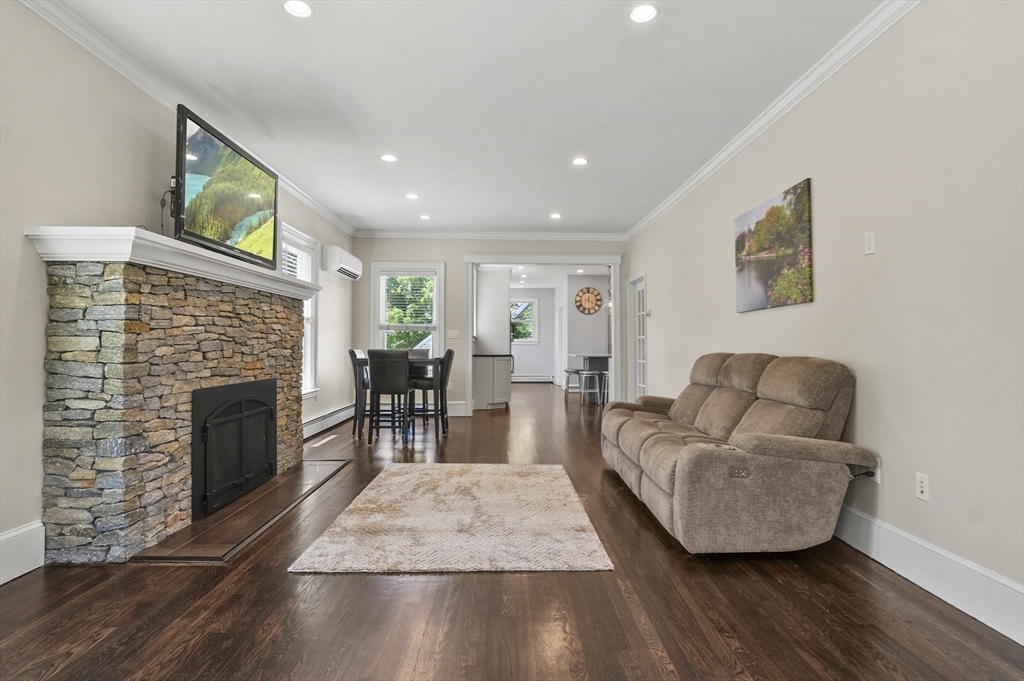 5 Waban Street Natick, MA 01760 - Photo 12 of 32 a living room with furniture and a fireplace