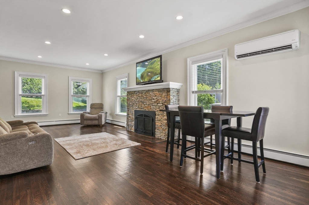 5 Waban Street Natick, MA 01760 - Photo 13 of 32 a living room with furniture and a fireplace