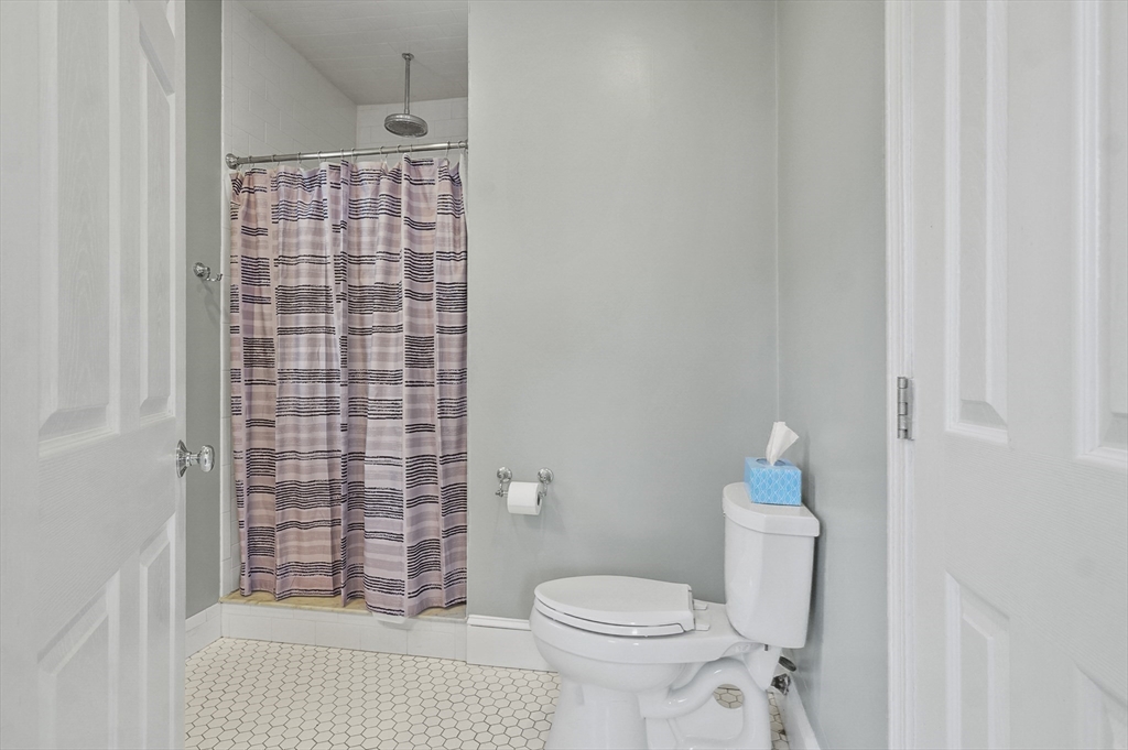 5 Waban Street Natick, MA 01760 - Photo 14 of 32 a bathroom with a toilet and shower