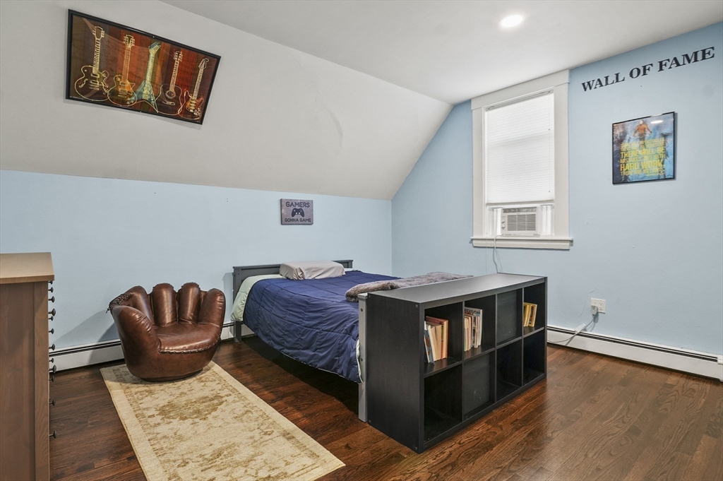 5 Waban Street Natick, MA 01760 - Photo 24 of 32 a living room with stainless steel appliances furniture a rug and a window