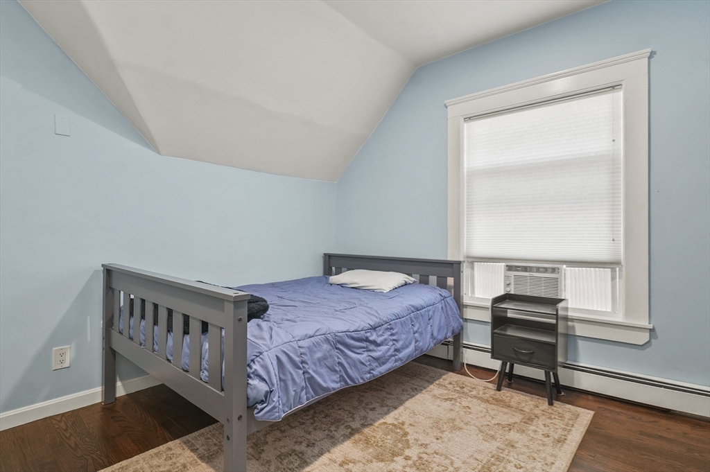 5 Waban Street Natick, MA 01760 - Photo 26 of 32 a bedroom with a bed and a window