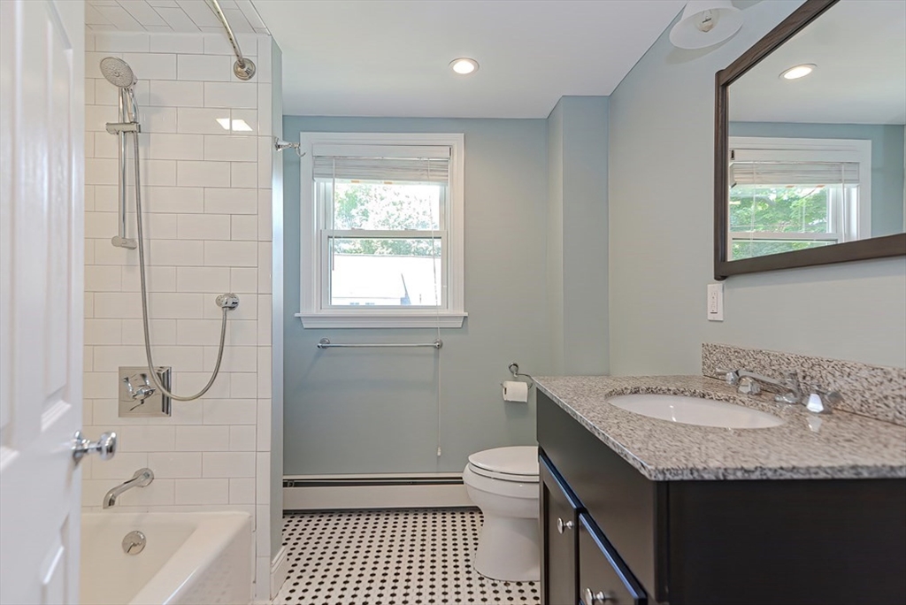 5 Waban Street Natick, MA 01760 - Photo 28 of 32 a bathroom with a granite countertop sink a toilet and shower