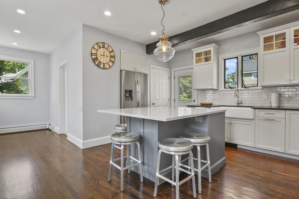 5 Waban Street Natick, MA 01760 - Photo 6 of 32 a kitchen with a table and chairs in it