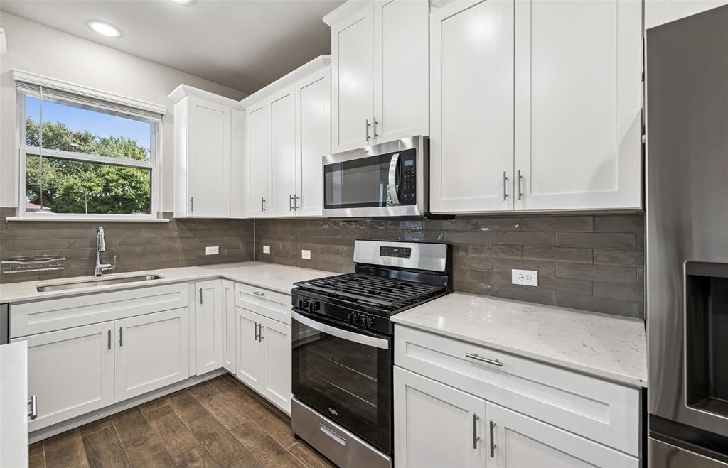 3073 Hamilton Street Plano, TX 75075 - Photo 14 of 30 a kitchen with appliances a sink and cabinets