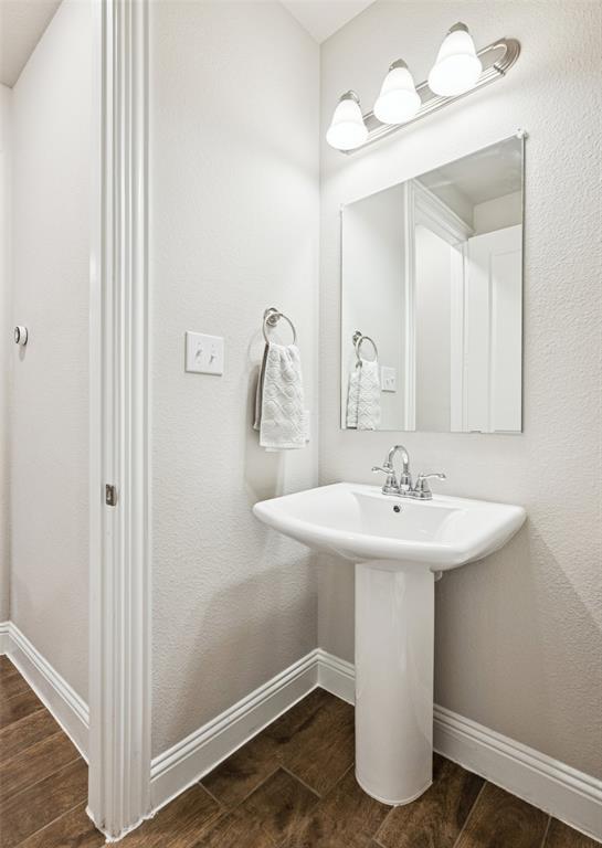 3073 Hamilton Street Plano, TX 75075 - Photo 17 of 30 a bathroom with a sink a mirror and vanity
