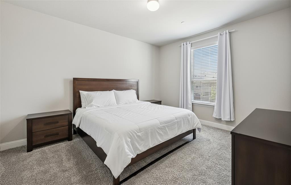 3073 Hamilton Street Plano, TX 75075 - Photo 21 of 30 a bedroom with a bed and a window