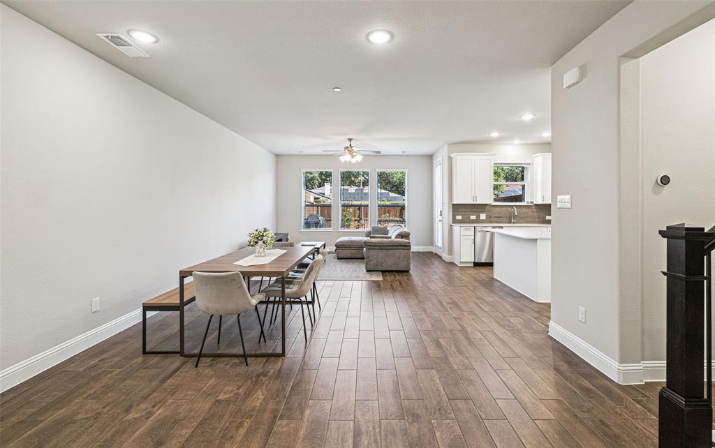 3073 Hamilton Street Plano, TX 75075 - Photo 7 of 30 a living room with furniture a large window wooden floor and a table
