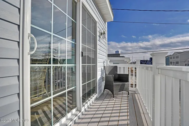 a view of balcony with furniture