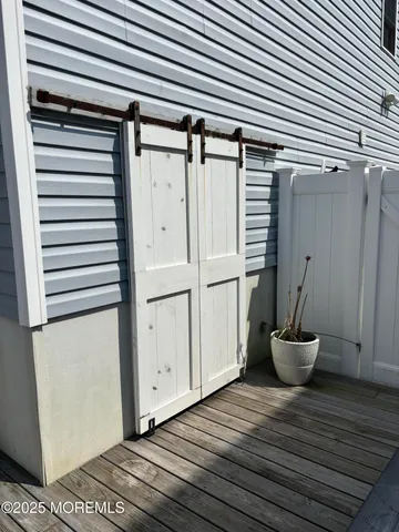 a view of a room and wooden floor