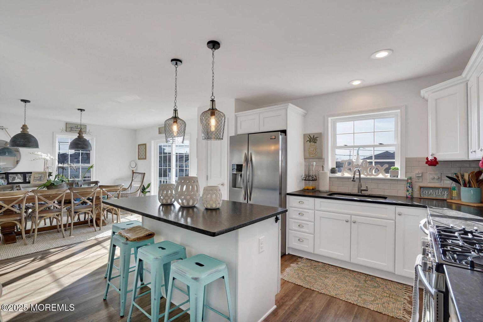 304 6th Avenue Seaside Heights, NJ 08751 - Photo 6 of 20 a kitchen with stainless steel appliances kitchen island granite countertop a sink and cabinets