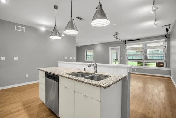 a kitchen with a sink and a refrigerator