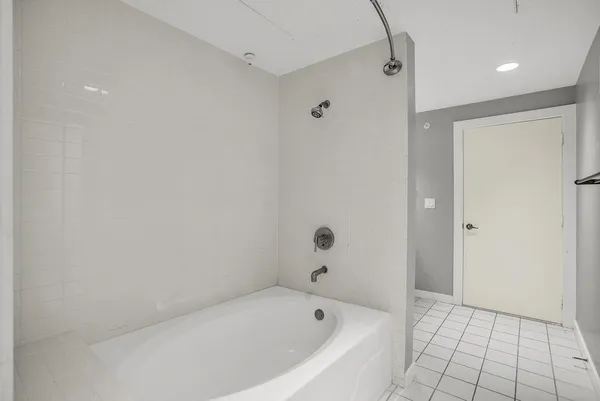 a white bath tub sitting in a bathroom