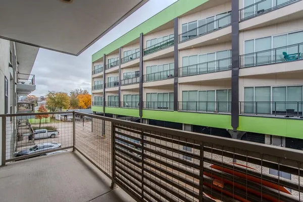 a view of a balcony with a street