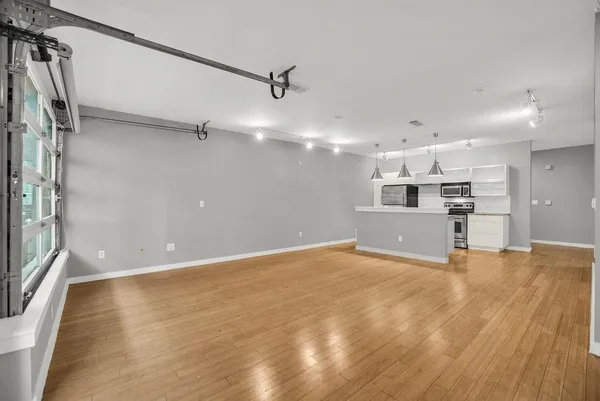 a view of a kitchen with a dishwasher and a refrigerator