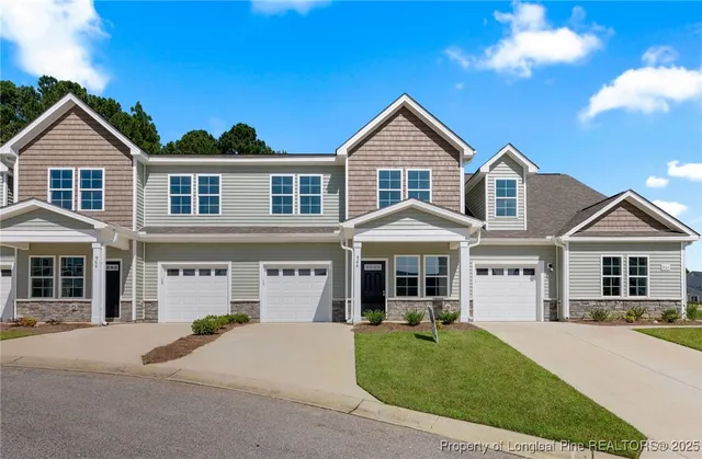 a view of house with yard