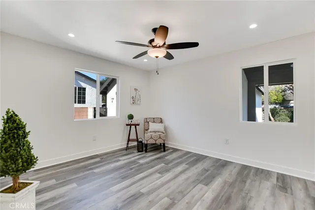 a view of workspace with furniture window and ceiling fan