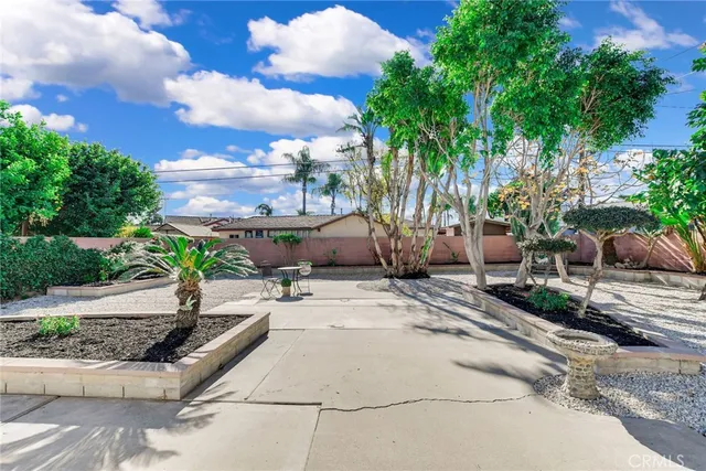 a view of a backyard with sitting area