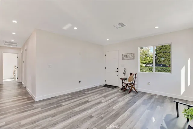 a kitchen with a sink stainless steel appliances and cabinets