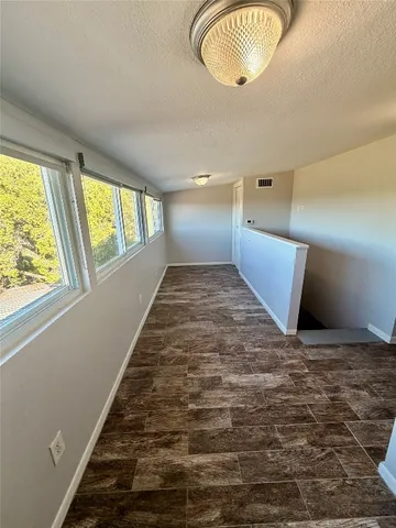 a view of an empty room and window