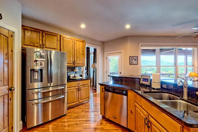a view of bathroom with a toilet and a window