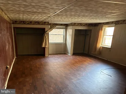 a kitchen with a sink a stove and a refrigerator