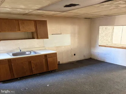 a room with pool table and a window