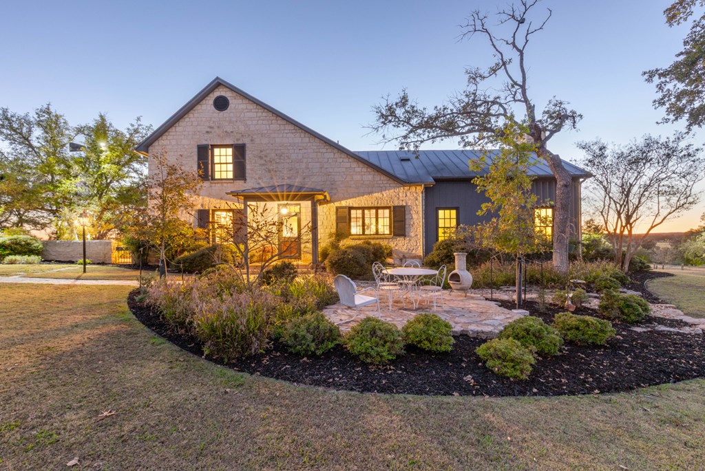 1129 Triple Creek Road Fredericksburg, TX 78624 - Photo 13 of 78 a front view of a house with garden