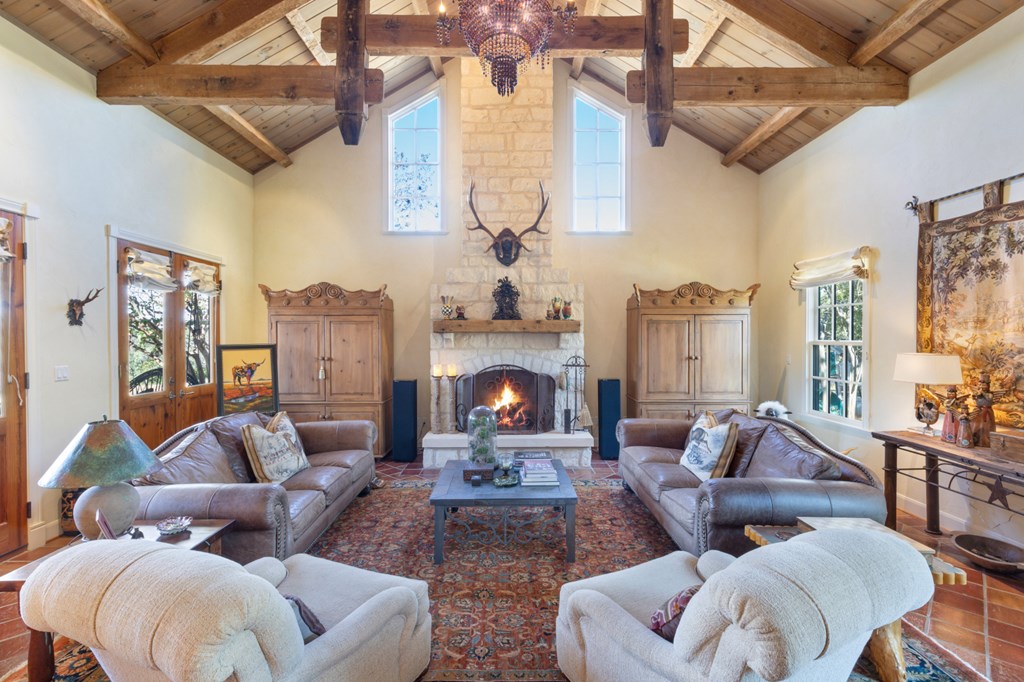 1129 Triple Creek Road Fredericksburg, TX 78624 - Photo 20 of 78 a living room with furniture and a fireplace