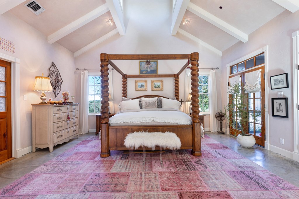 1129 Triple Creek Road Fredericksburg, TX 78624 - Photo 31 of 78 a bedroom with a large bed and a window