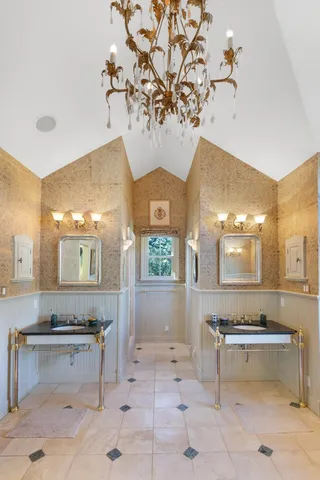 a backyard of a house with barbeque oven table and chairs