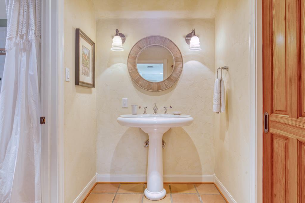 1129 Triple Creek Road Fredericksburg, TX 78624 - Photo 46 of 78 a bathroom with a sink and a mirror