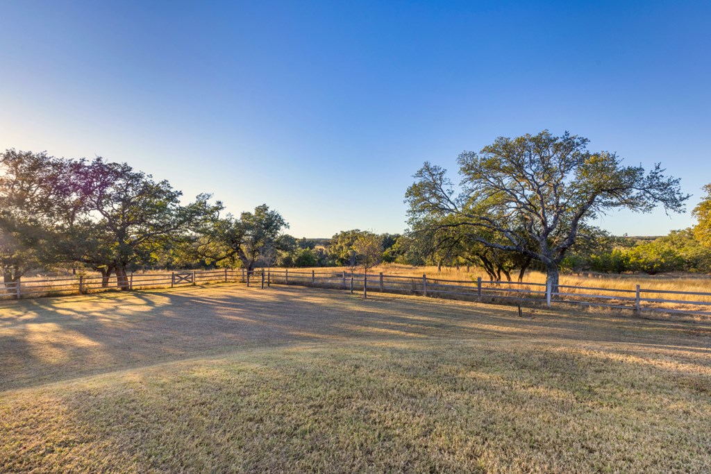 1129 Triple Creek Road Fredericksburg, TX 78624 - Photo 62 of 78 a view of dirt field with trees