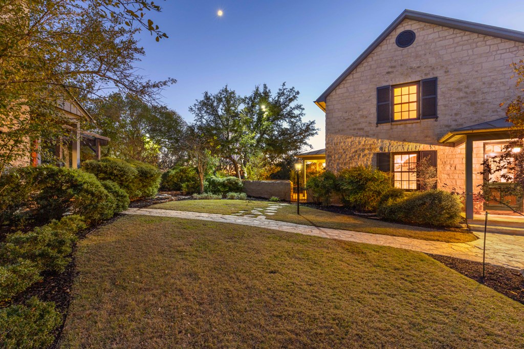 1129 Triple Creek Road Fredericksburg, TX 78624 - Photo 65 of 78 a front view of a house with a yard