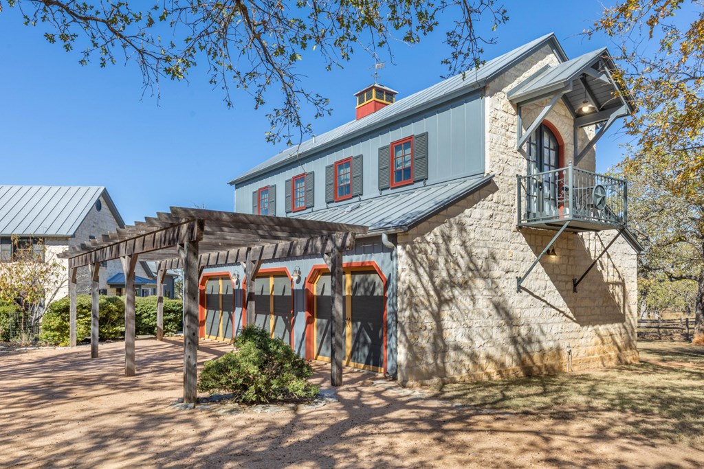 1129 Triple Creek Road Fredericksburg, TX 78624 - Photo 8 of 78 a front view of a house with a yard
