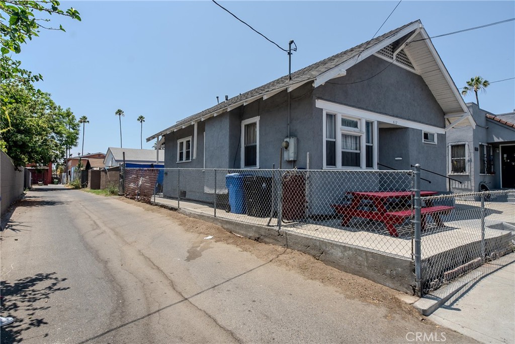 2500 Trinity Street Los Angeles, CA 90011 - Photo 5 of 12 a front view of a house with wooden fence