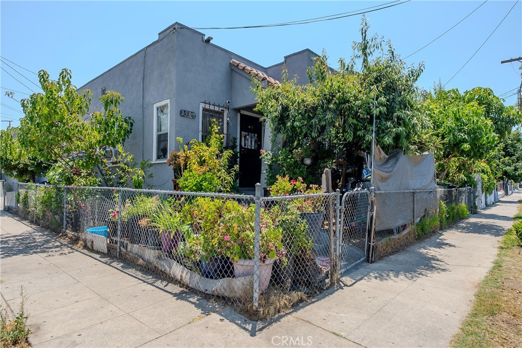 2500 Trinity Street Los Angeles, CA 90011 - Photo 7 of 12 front view of a house with a small yard