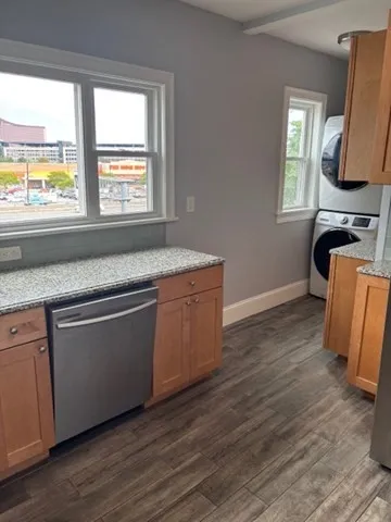a kitchen with wooden floors and a sink
