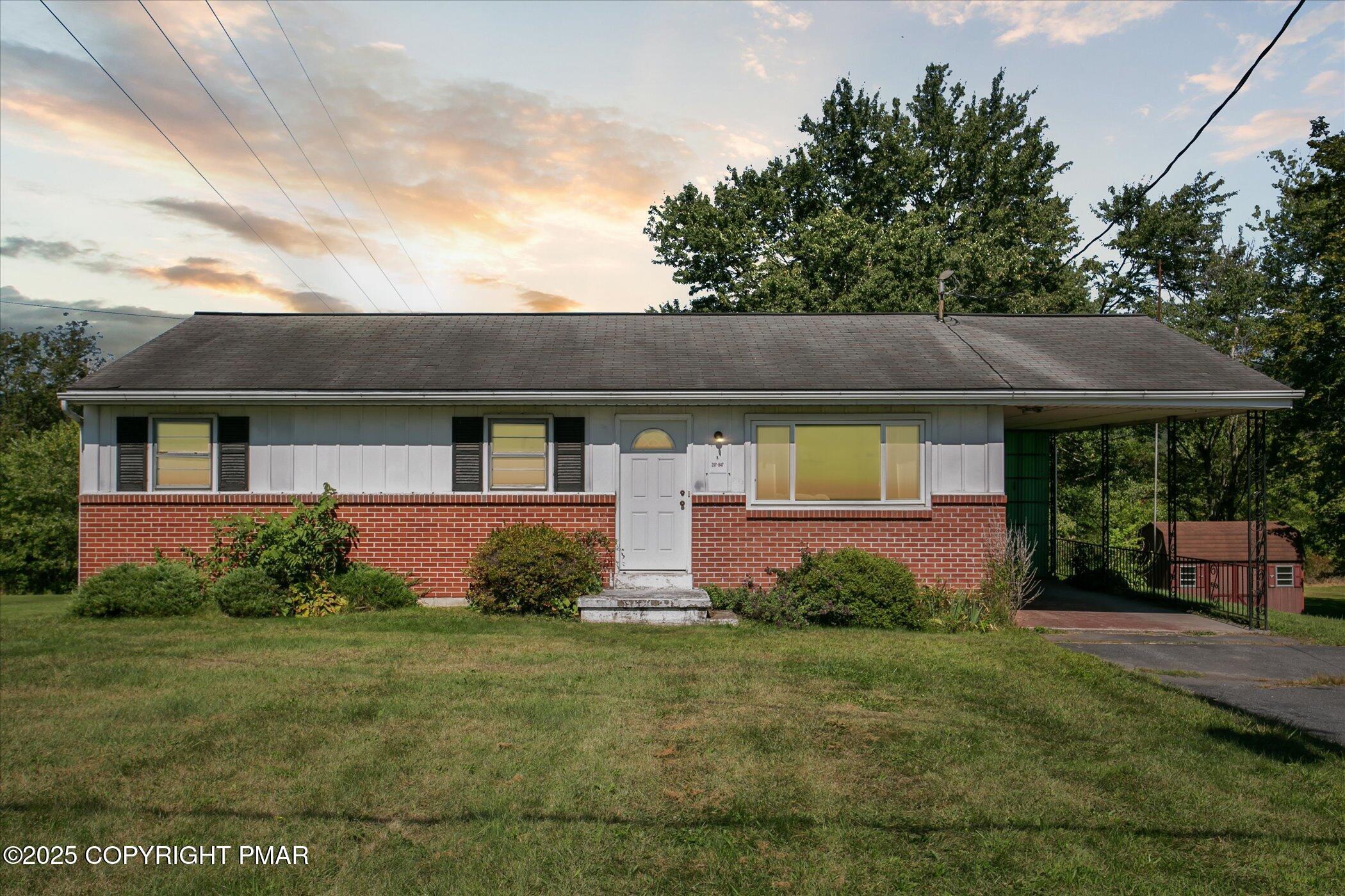 front view of a house with a yard