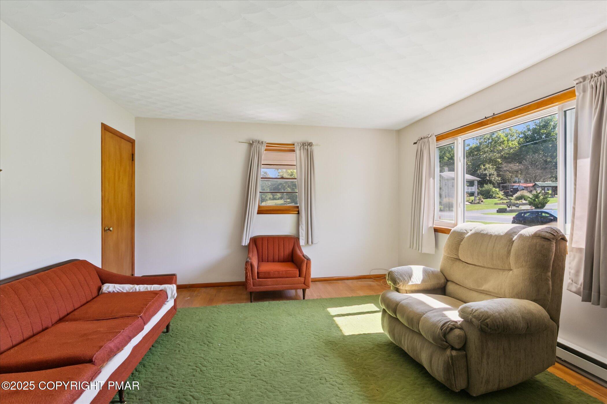 145 Sweet Arrow Lake Road Pine Grove, PA 17963 - Photo 12 of 38 a living room with furniture and a large window